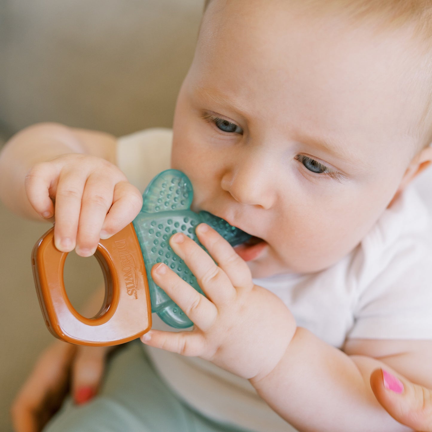 Teething at 4 Months: Signs, Benefits of Teethers & What Parents Need to Know