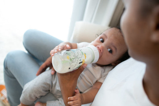 Breastfed Baby Paced Feeding Baby Taking In Air While Bottle
